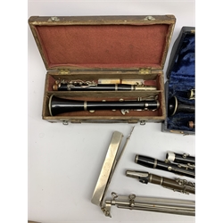  Six clarinets comprising Hawkes & Son No. 9026 in leather case, unmarked E-flat bakelite, Hawkes & Son B-flat No. 8854, Corton B-flat No. 550 in wooden box, Penzel Bros. New York B-flat and Rampone Milano E-flat in associated case, three lacking mouthpiece and connector and a folding music stand  
