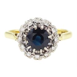 Gold sapphire and diamond cluster ring, single round cut sapphire, surrounded by twelve si...