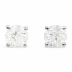 Pair of 18ct white gold diamond earrings, each stud four claw set with a single round bril...