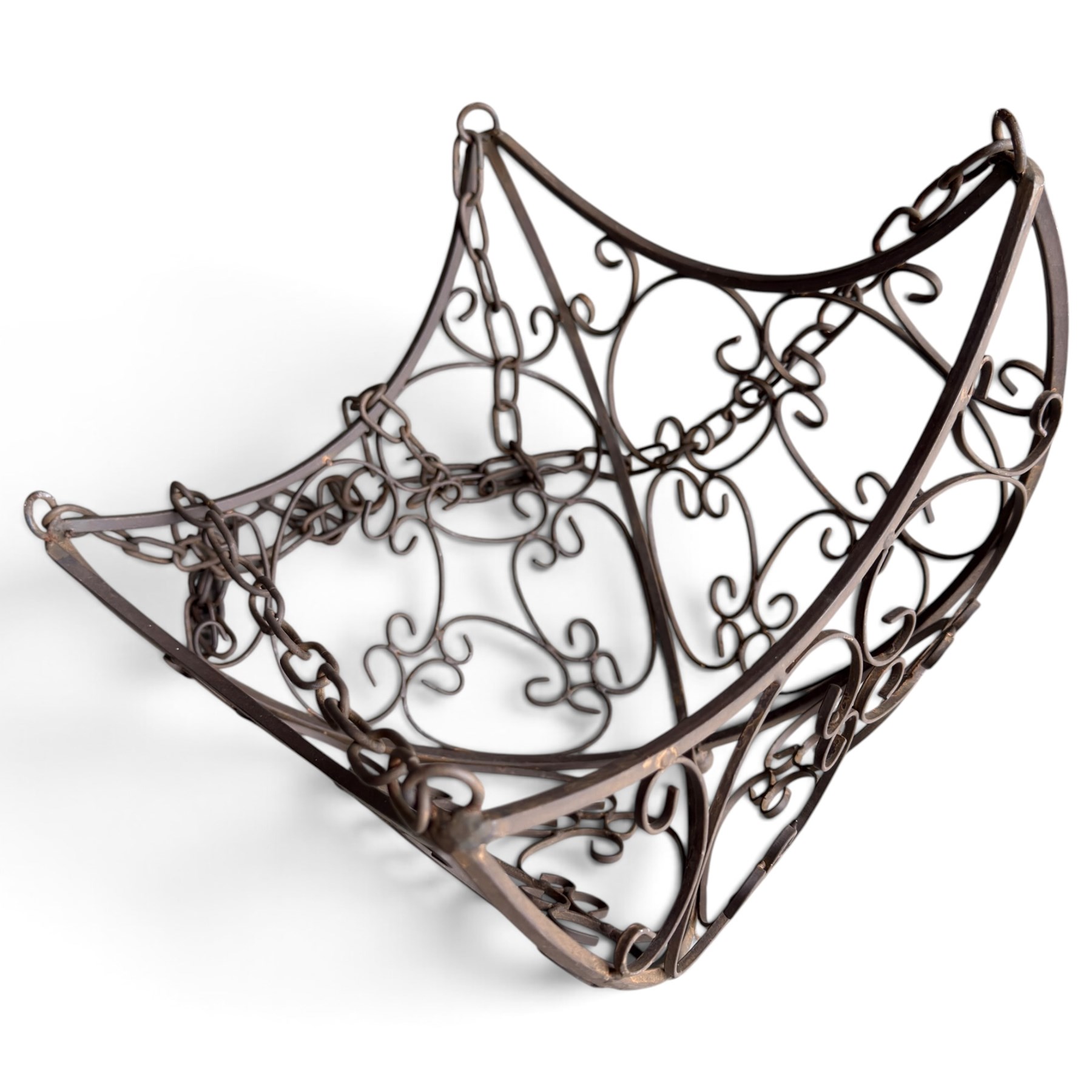 Three wrought iron garden basket planters, comprising a circular pierced and scrolling basket on tall tripod stand with scrolling supports (W31cm H76cm), and a pair of matching hanging baskets (W37cm H30cm)