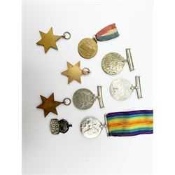 WWI British War medal awarded to 1261 Dvr. T. Paylor R.A., six WWII medals including three stars, WWII souvenir matchbox sleeve, hallmarked silver ARP badge, and an album of photographs and postcards of WWII interest, including Hitler, Montgomery, Churchill, action shots, aircraft, etc. 