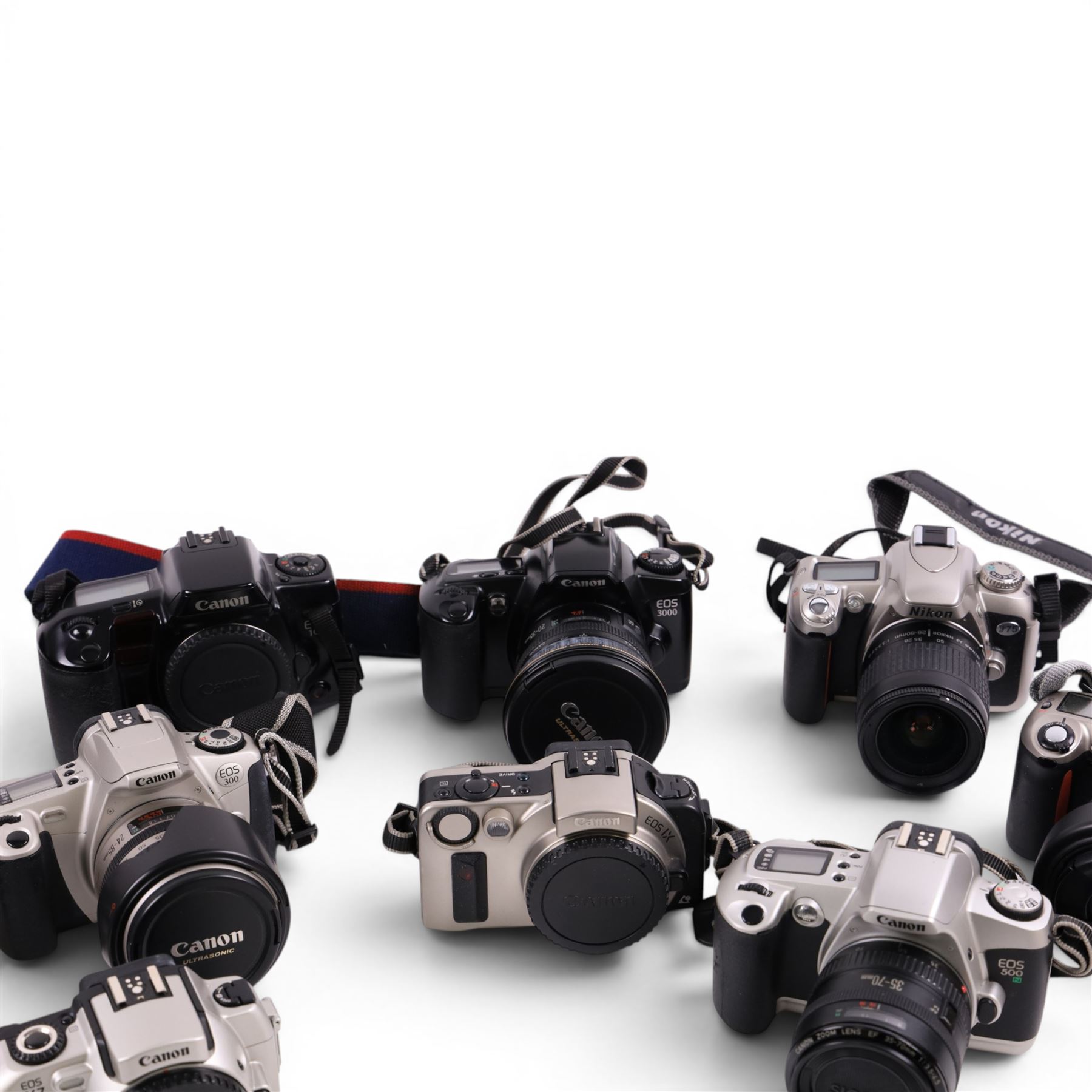 Ten digital cameras, including seven Canon EOS examples, Nikon F65, Nikon Pronea and Nikon F75