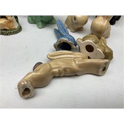 Collection of Sylvac and similar animal figures, including rabbits, hares and dogs, together with Falcon budgie vase, etc 