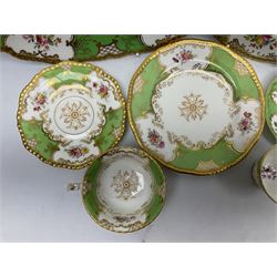 Coalport green batwing pattern tea wares, decorated with finely enamelled floral sprays within gilt reserves, comprising teacup trio, twin handled cake plate and side plate, pattern no Y2665, together with a Coalport for Harrods cup and saucer similarly decorated, the saucer with stamped mark beneath 'Manufactured for Harrods Ltd, Brompton Rd London', all with green Coalport AD 1750 marks beneath, largest W31cm (7)