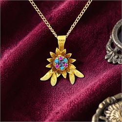 18ct gold ruby, sapphire and turquoise flower head pendant, set with single sapphire, surr...
