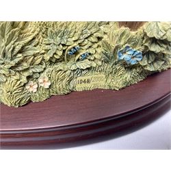 Four Border Fine Arts Beatrix Potter figures, comprising Tableau created to commemorate the Millenium together with a Border Fine Arts Limited Edition no 669814, The Tale of Peter Rabbit Tablet A1306, Four Little Rabbits A2442 and Sailing Home A2443