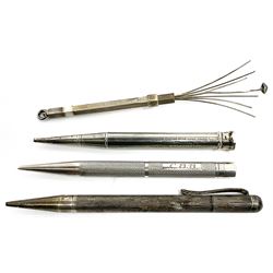 Three silver propelling pencils, each with engine turned decoration, two examples hallmarked Birmingham 1957, the other marked Sterling Silver, plus a silver swizzle stick, hallmarked London, date letter and maker's mark worn and indistinct. 