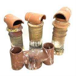 Three early 20th century circular chimney pots and a double chimney pot - THIS LOT IS TO BE COLLECTED BY APPOINTMENT FROM DUGGLEBY STORAGE, GREAT HILL, EASTFIELD, SCARBOROUGH, YO11 3TX
