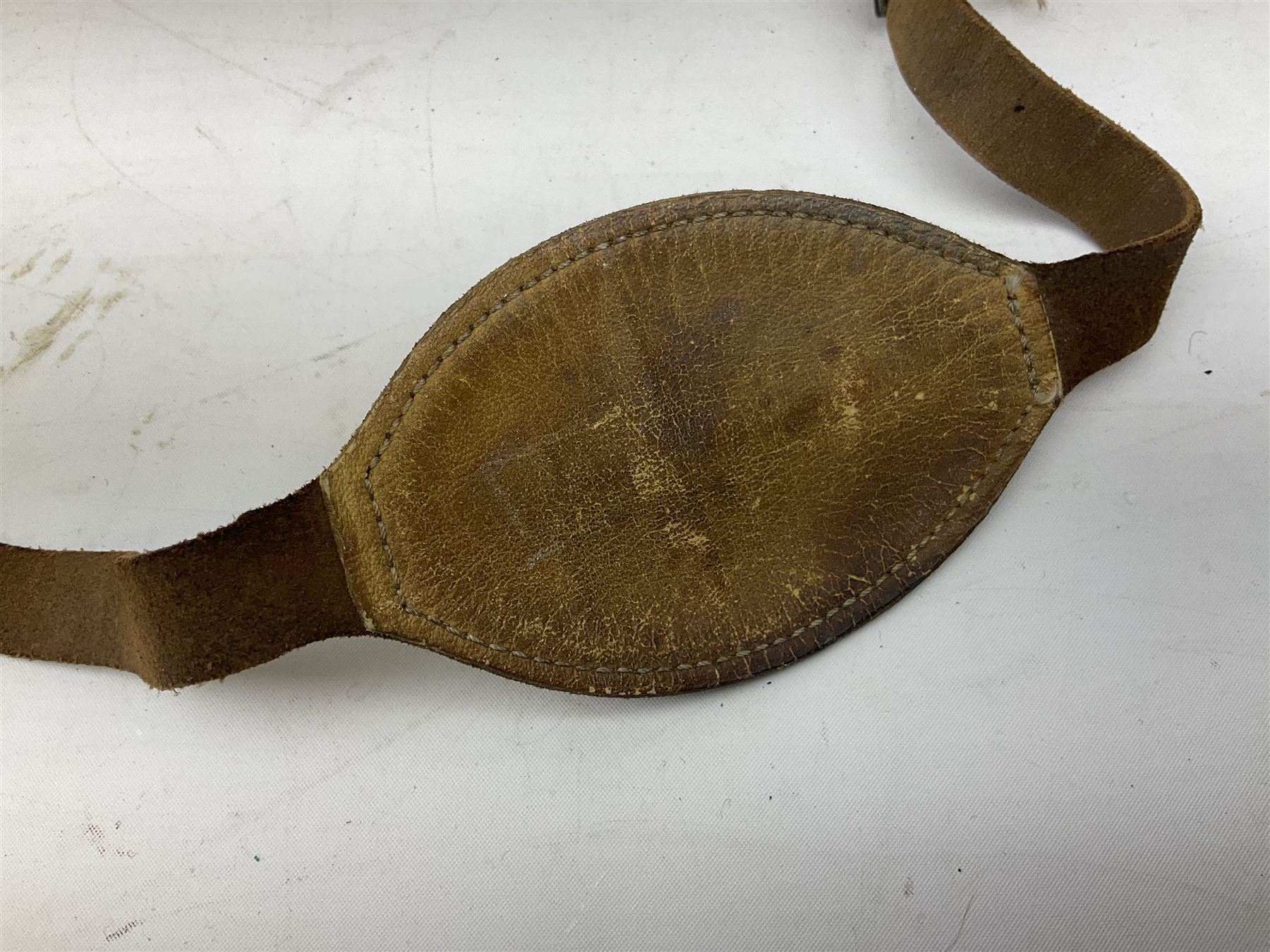 WW2 RAF sidecap dated 1942 with badge and buttons; quantity of RAF metal and cloth badges, pips and buttons; and paratrooper's helmet chin strap
