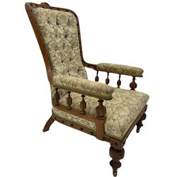 Victorian oak armchair, shaped and moulded frame decorated with ebonised beads, the upholstered arms supported by lobe spindle balustrade, in buttoned floral pattern fabric 