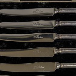 Set of six 1920s silver teaspoons with engraved initials, together with two sets of silver handled tea and fruit knives, all hallmarked and all within fitted cases