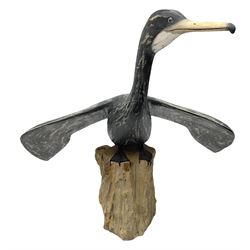 Wooden sculpture of Cormorant aquatic bird on a naturalistic wooden plinth, H46cm