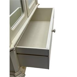 French design cream painted armoire wardrobe, shaped top with shell and flower head pediment, enclosed by two mirror glazed doors, the base fitted with single drawer