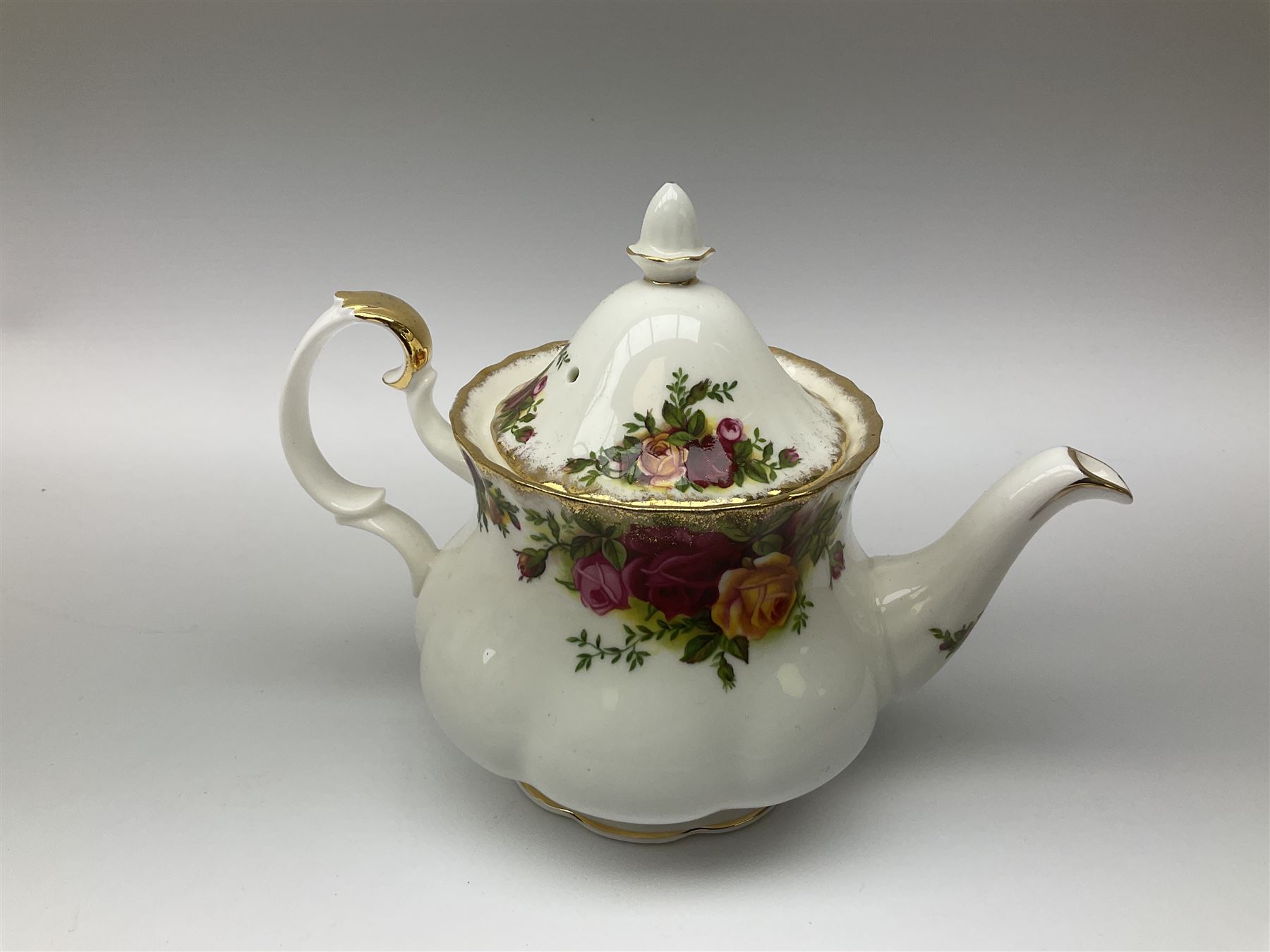 Royal Albert Old Country Roses pattern tea set, comprising teapot, coffee pot, six teacups and six saucers, five side plates, further teacup with joined saucer and side plate, open sucrier, milk jug, cake plate, and preserve pot and cover, together with Royal Albert Jubilee Rose pattern sauce boat and stand, and Royal Albert Lavender Rose pattern cake stand. 