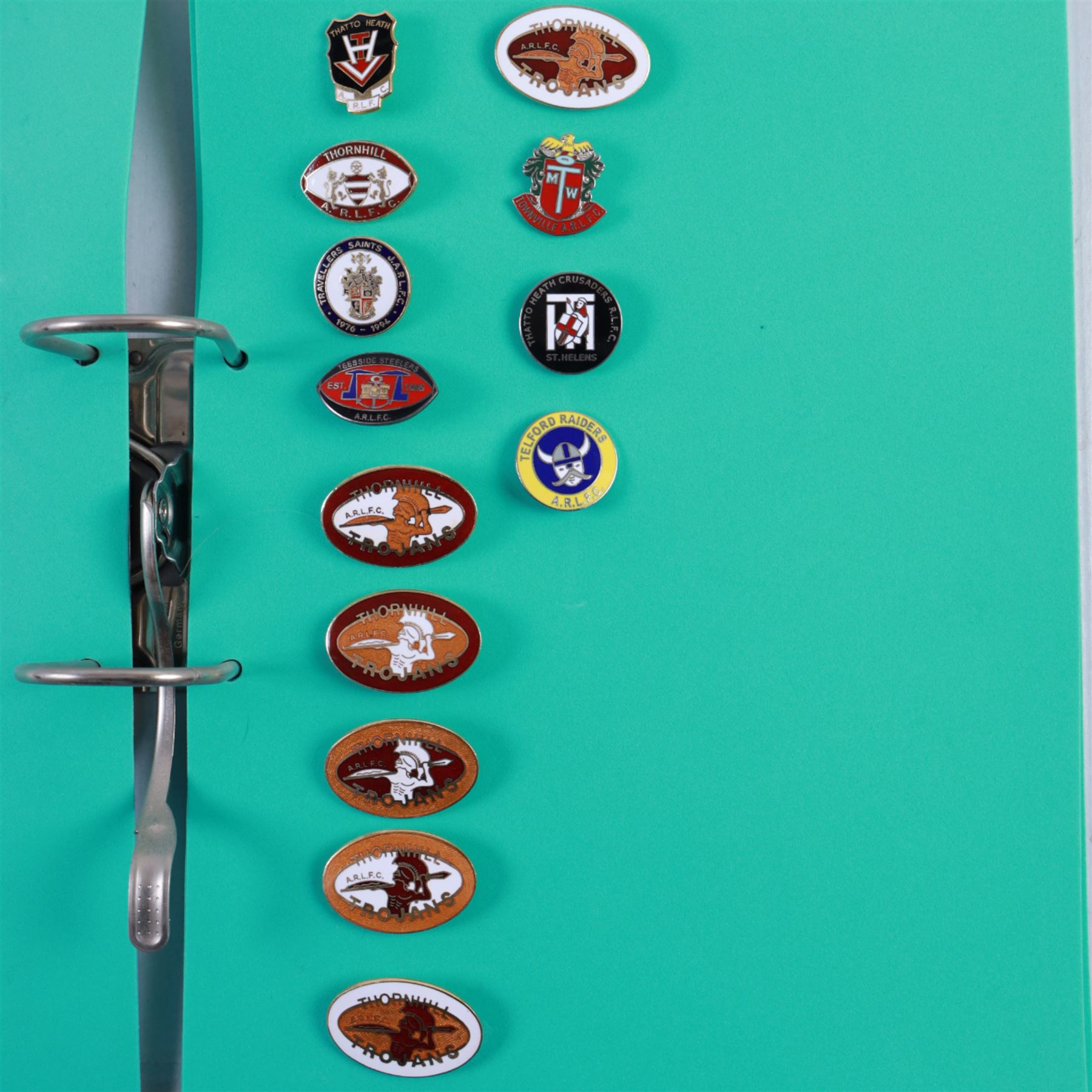 Amateur rugby league enamel badge collection, teams including Birmingham Bulldogs, Bridlington, Dudley Hill, Duke of York, Edinburgh Eagles, Guiseley, Rangers, Huntingdon, Keighley Town, Leigh Miners, Pilkington Recs, St Josephs, Thornhill Trojans, West London Sharks etc, all displayed in three folders and six amateur league badges from Leeds & District, Hull & District, York & District, Warrington, Lancashire County and Yorks County in box display, (approximately 270)