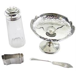 Early 20th century pedestal dish, the circular bowl with shaped rim and scroll pierced sides upon a baluster stem and spreading circular foot, hallmarked William Hutton & Sons Ltd, Birmingham 1918, together with a 1920's cut glass sugar caster with silver cover, hallmarked A J Pepper & Co, Birmingham 1923, a 1920's silver butter knife, hallmarked James Swann & Son, Birmingham 1925, and napkin ring of compressed form, stamped Silver, approximate silver weight 6.03 ozt (187.8 grams)