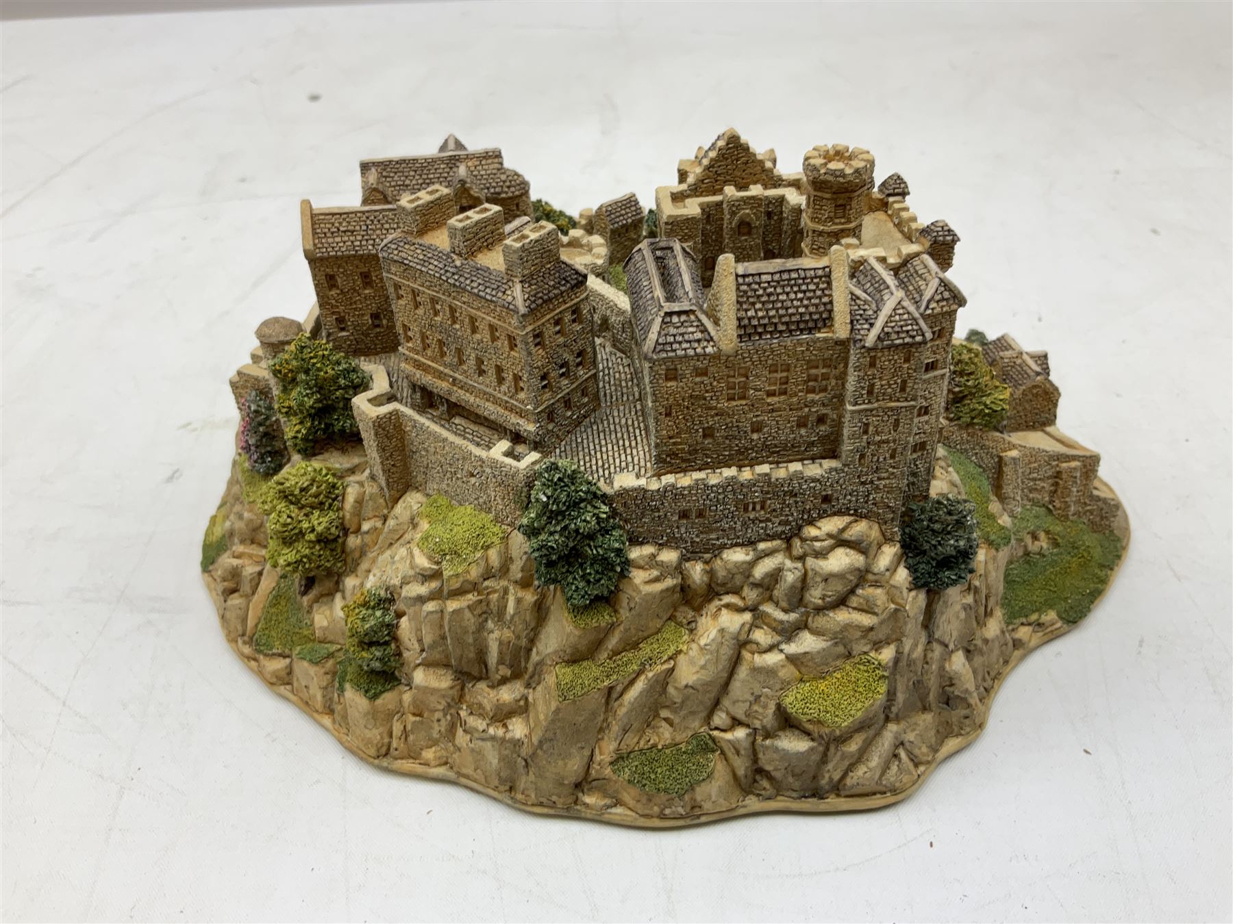 Four Lilliput Lane models from the 'Britain's Heritage' collection, comprising Edinburgh Castle, The World Famous Blacksmith's Shop Gretna Green, Shakespeare's Birthplace and Mickelgate Bar York, together with  a Lilliput Lane Beatrix Potter Hill Top model, all boxed