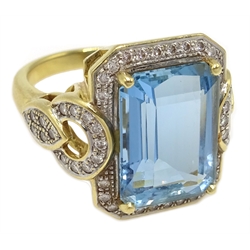  18ct gold emerald cut aquamarine and diamond dress ring, hallmarked    