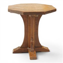 Mouseman - mid-20th century adzed oak coffee table of small proportions, the octagonal  adzed top raised on cruciform base and sledge feet, carved with mouse signature, by the workshop of Robert Thompson of Kilburn 