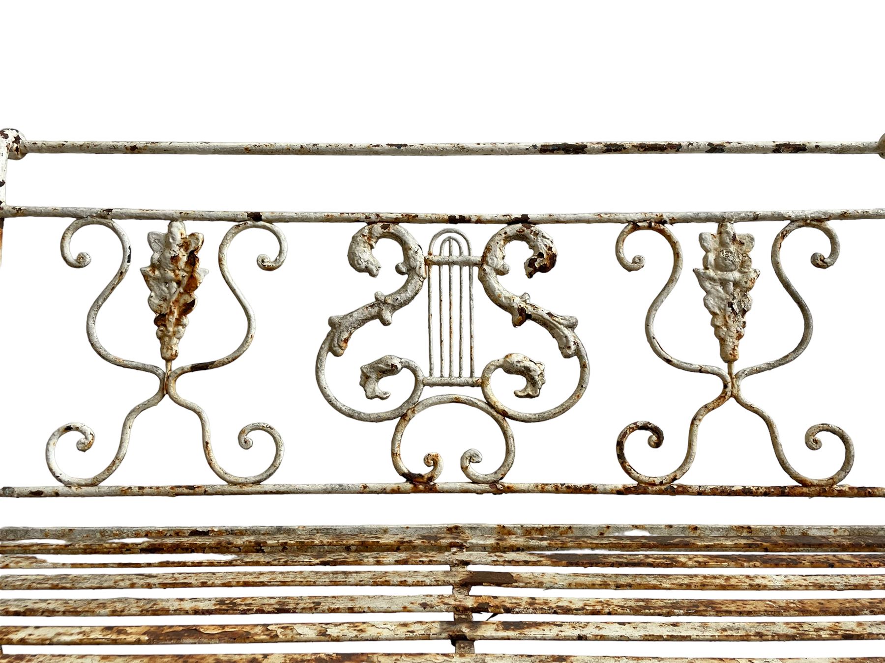Regency design wrought metal garden bench, central lyre back with foliate S-scrolls with serpent masks, flanked by two floral mouldings and further scrolling, metal slatted seat on straight supports joined by H-stretcher  - THIS LOT IS TO BE COLLECTED BY APPOINTMENT FROM DUGGLEBY STORAGE, GREAT HILL, EASTFIELD, SCARBOROUGH, YO11 3TX