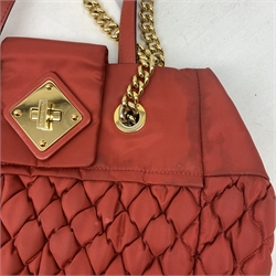 A Moschino red quilted handbag, with gold coloured hardware, L37cm. 