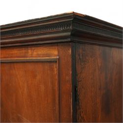 George III mahogany linen press, dentil moulded cornice over a pair of panelled doors enclosing a later fitted interior, lower section with two short over one long cockbeaded drawer, brass swan neck handles, shaped bracket feet