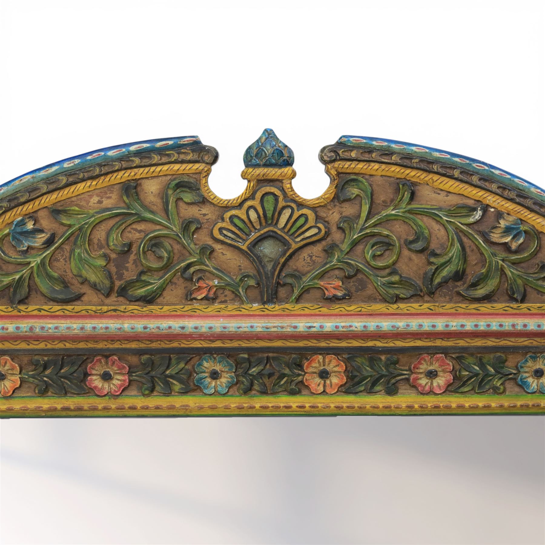 Late 20th century Venetian style polychrome carved wall mirror, arched cresting with central shell motif and scrolling foliate decoration, moulded frame with carved floral borders in relief, enclosing rectangular mirror plate, shaped sides with scroll terminals