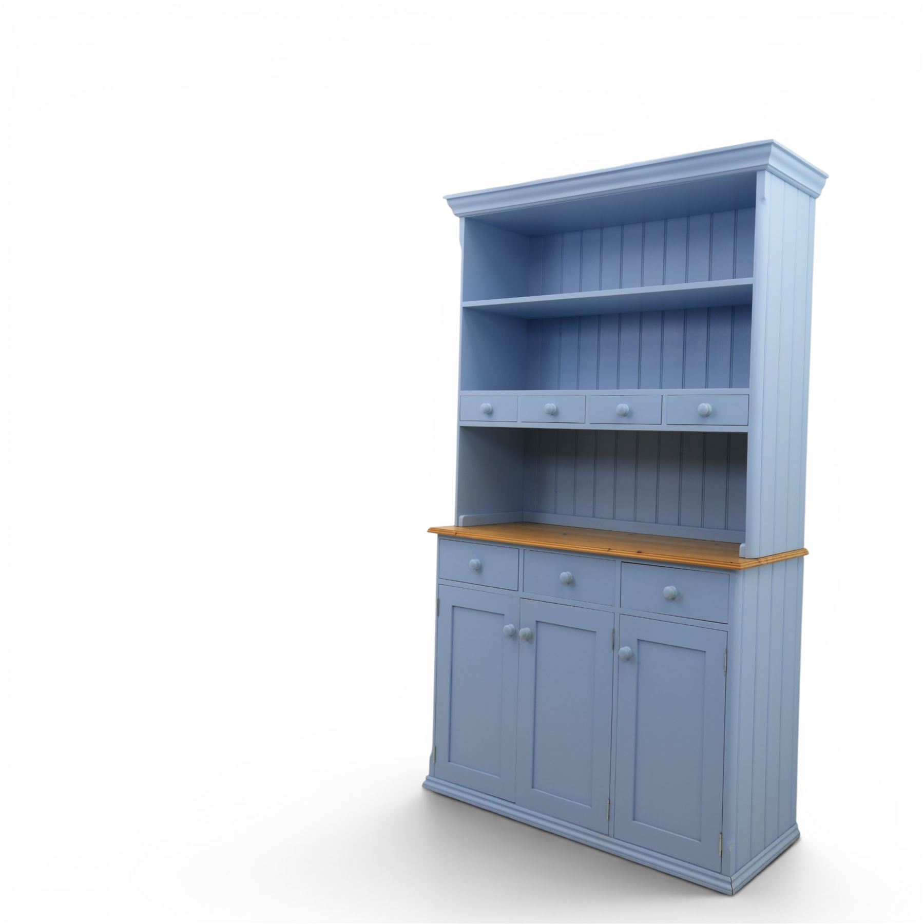 Pine blue painted dresser, upper section with tongue and grove back, two shelves with three short drawers, above a base with soft close short drawers, and three cupboard doors, raised on a moulded plinth base