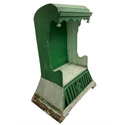 19th century painted pine hen coop settle, overhanging arched canape with dentil moulding and shaped edge, the panelled seat over a triangular platform base with removable hen-coop door, in green and white finish