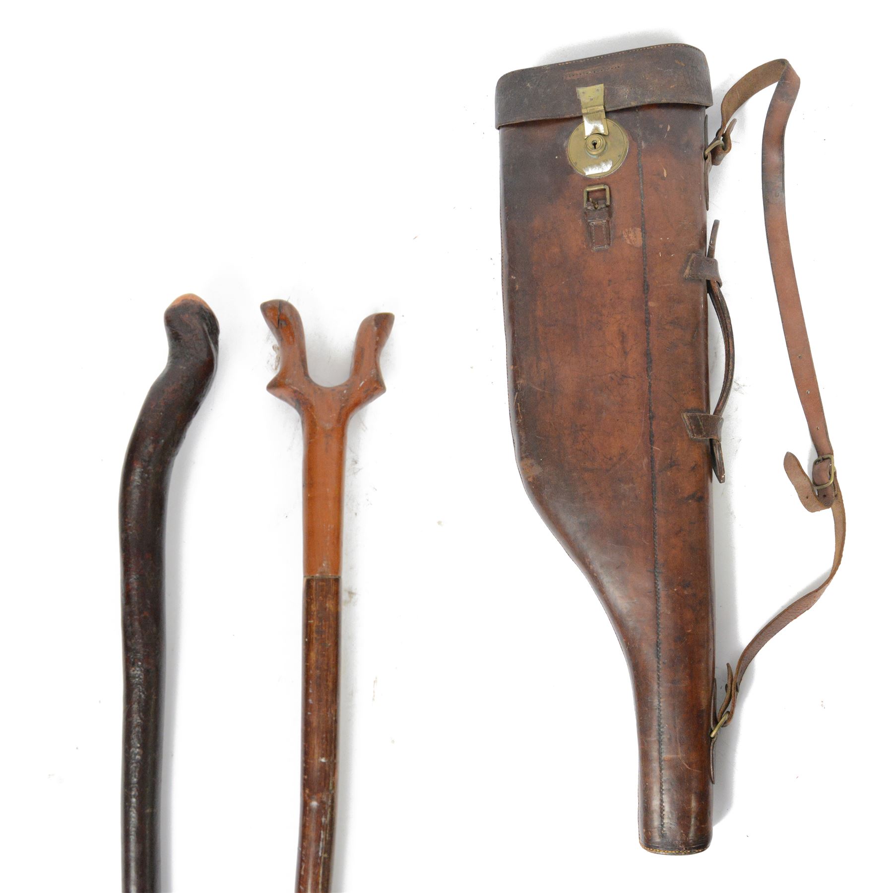 Leather leg of mutton shotgun case, with brass lock plate, L81cm, together with a walnut topped thumbstick L140.5cm, and a blackthorn walking stick L112cm