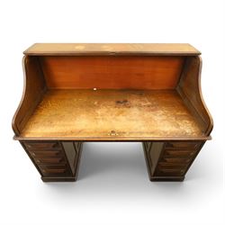 Cutler - Late Victorian oak pedestal tambour desk, the tambour shutter enclosing fitted interior, pull-out writing surface over central kneehole flanked by two pedestals each fitted with four drawers with moulded fronts, pull-out slides above, panelled sides, on moulded plinth base
