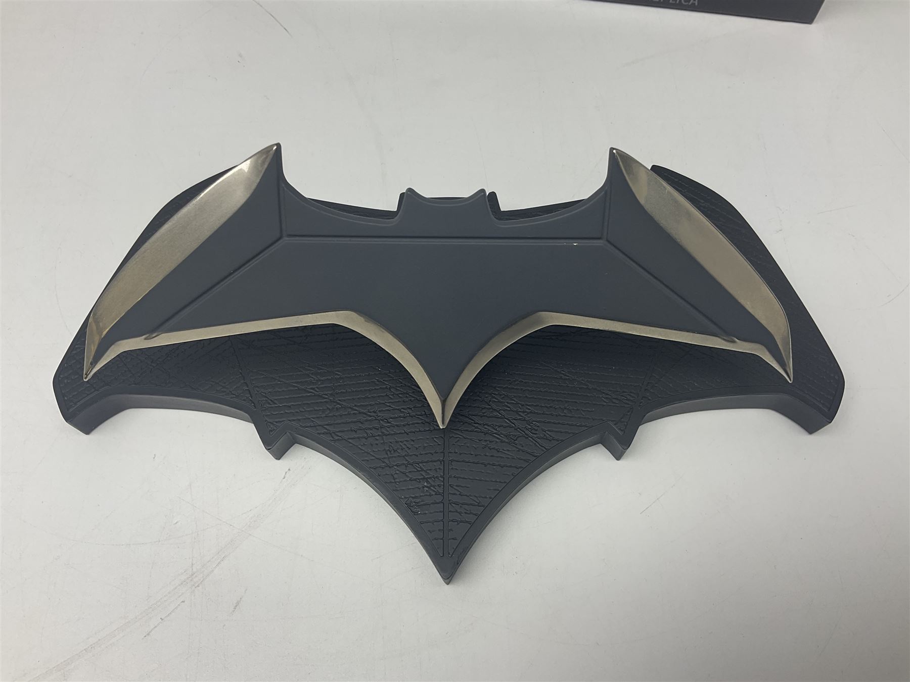 Two Batman replica Batarangs comprising DC Comics QMX Caliber Metalworks 1:1 scale replica with original box, and DC Direct The Dark Knight prop replica no. 33/1500 with original box and certificate of authenticity 