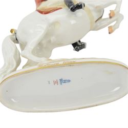 Royal Vienna Augarten figurine, modelled a Spanish Riding School rider upon rearing horse, with Trab-Spanische Reitschule Hofburg Wien in gilt to the base, H30cm