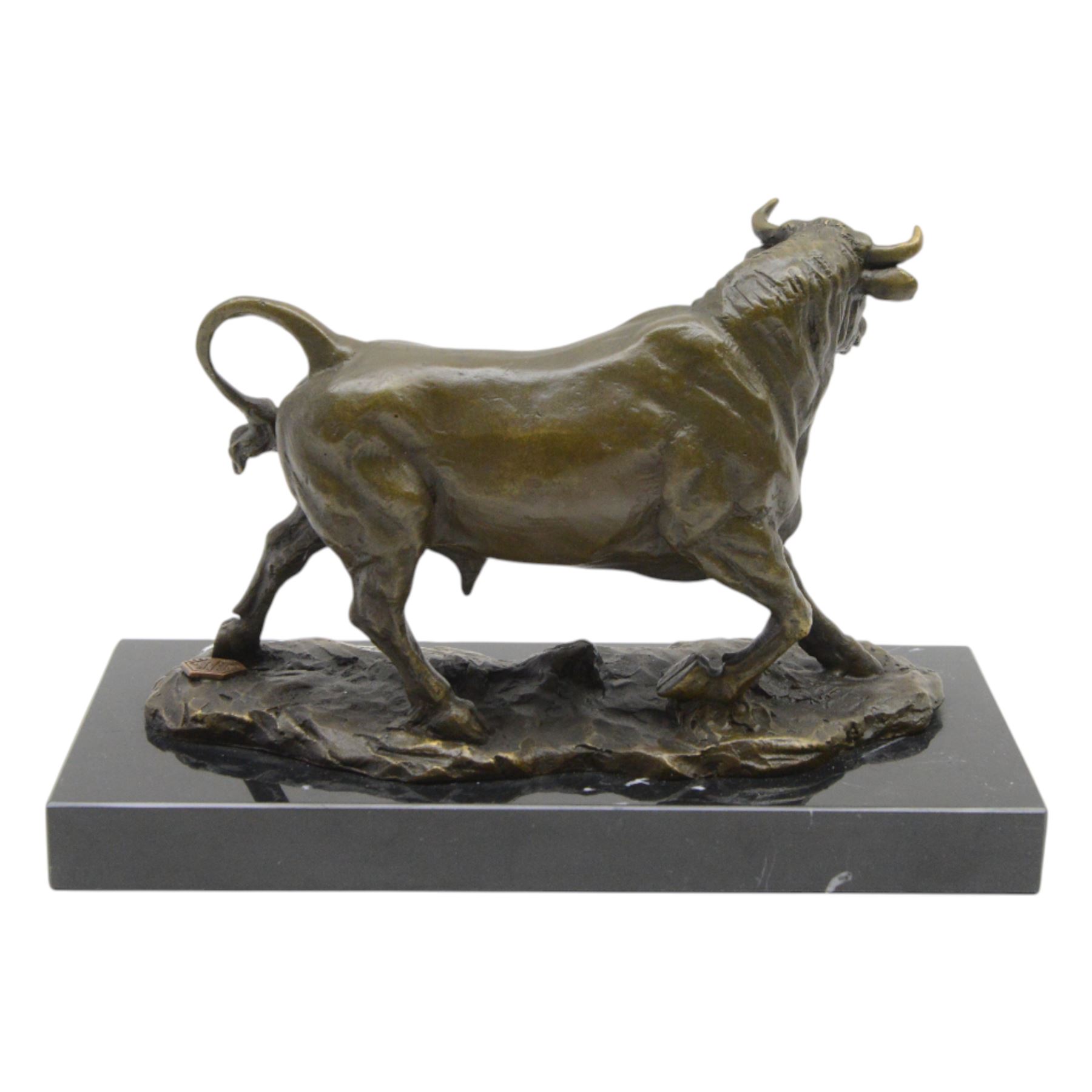 Bronze figure, modelled as a prancing bull, upon a naturalistic base signed Mils and with foundry mark, raised upon a rectangular marble base, overall H14cm