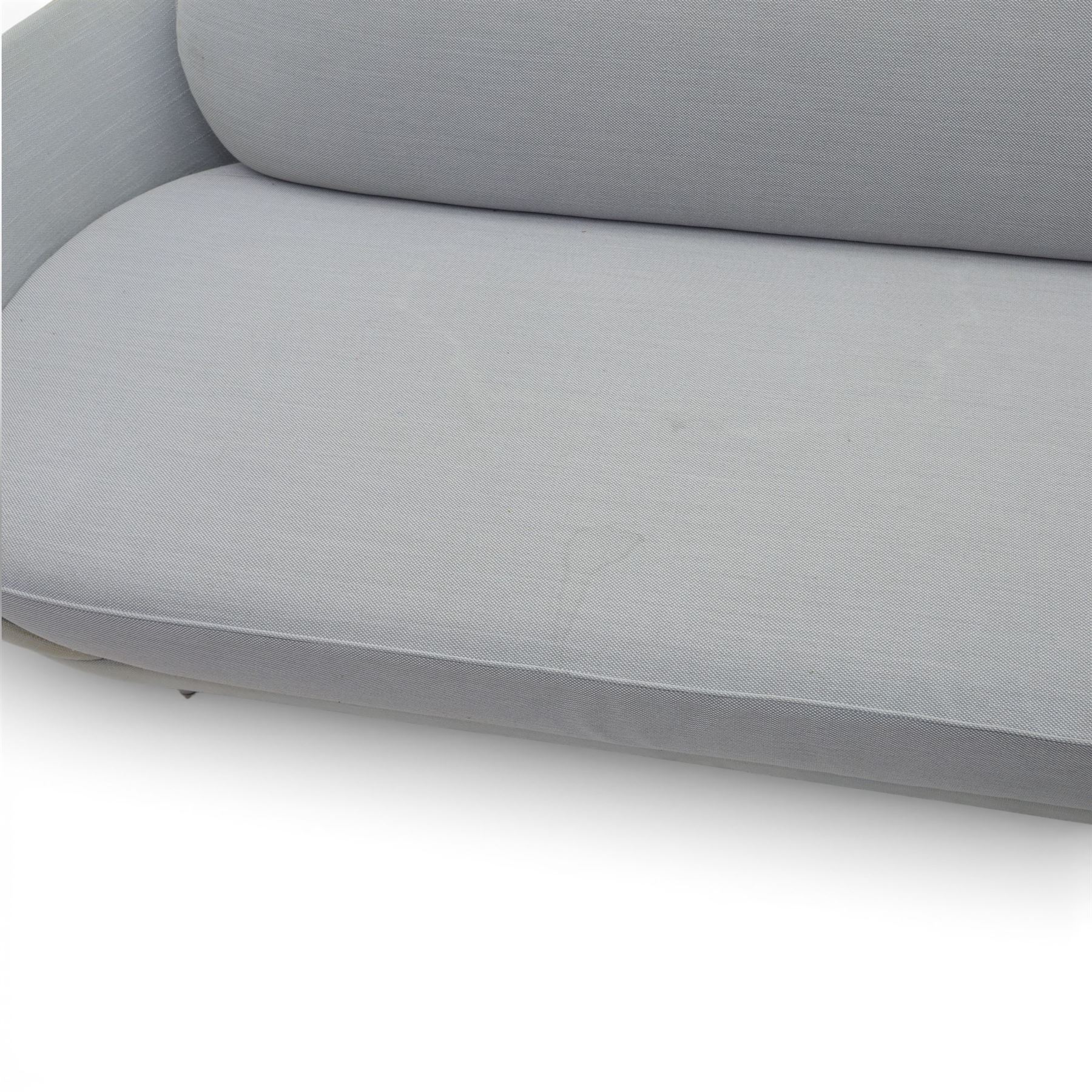 Fritz Hansen - 'Favn' sofa, designed by Jaime Hayon (1974-), upholstered in light grey fabric, the organic curved back and integrated arms enclosing loose seat and back cushions, raised on slender cylindrical metal supports