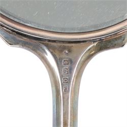 Silver mounted hand mirror, hallmarked together with silver mounted scent bottle and four other glass bottles