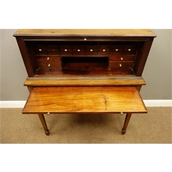  Early 19th century mahogany Estate cupboard, tambour front with an arrangement of twelve drawers including alphabetical open drawers, above brushing slide and single cock beaded drawer, square tapering supports with spade feet, W97cm, H115cm, D46cm  