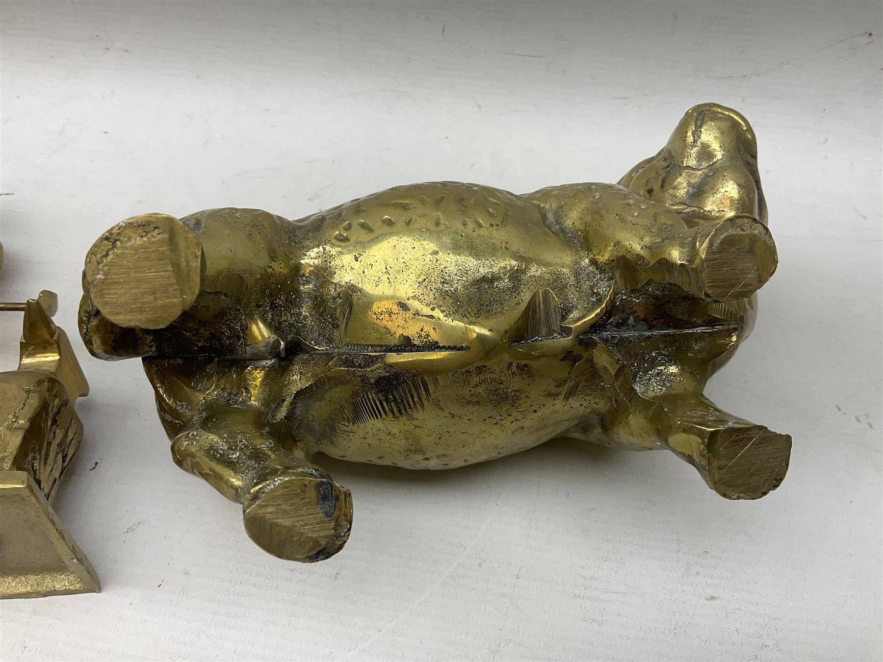 Large brass figure of a hereford bull, together with a brass figure of a blacksmith, bull H15cm