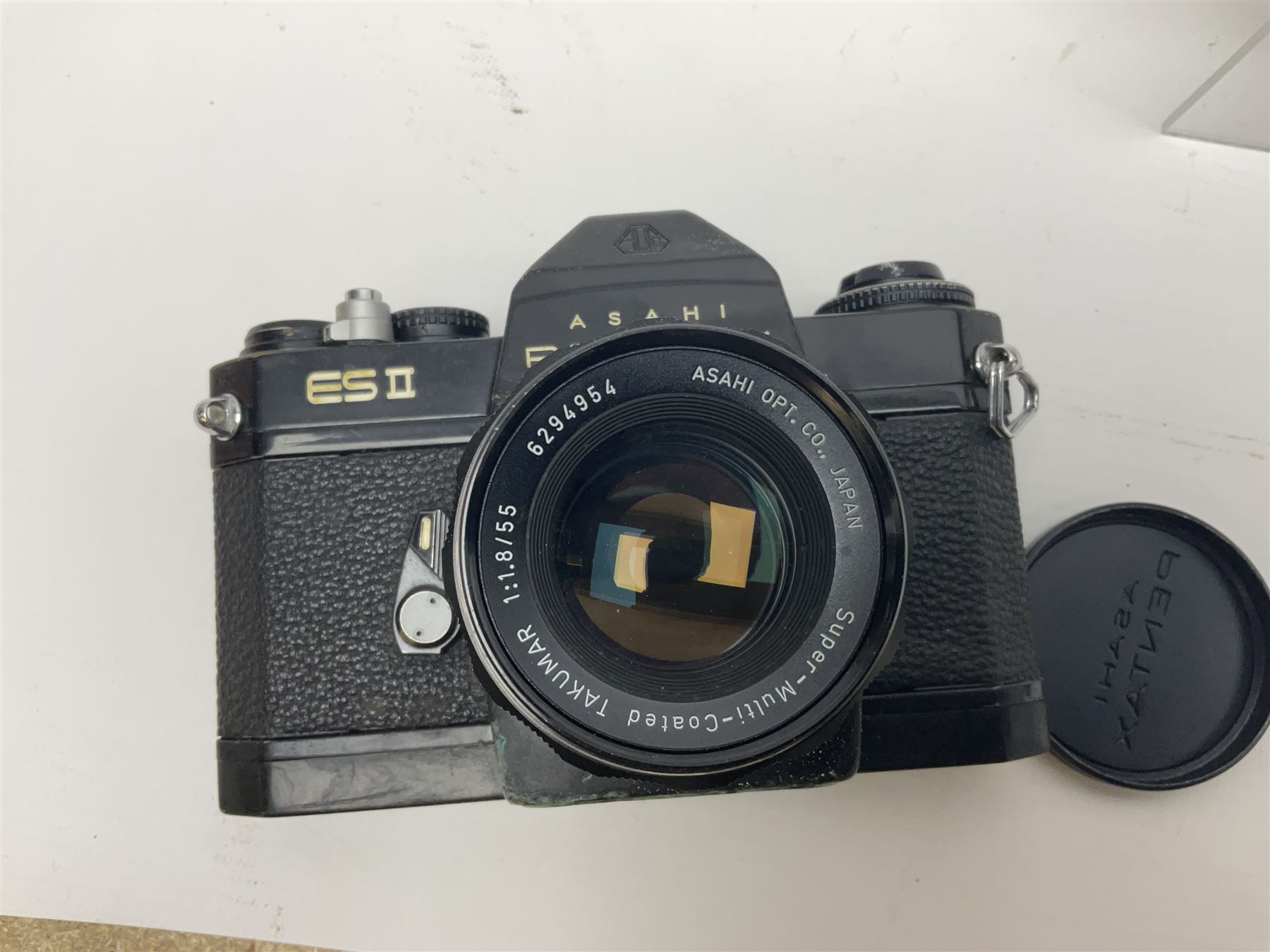 Olympus Pen-EE camera, serial no 415299, with Olympus D.Zuiko 1:3.5 f=2.8cm lens, together with four Olympus Trip 35 cameras, serial nos 4759245, 4257589, 1847727 and 5387611, each with Olympus D. Zuiko 1:28 f=40mm lenses