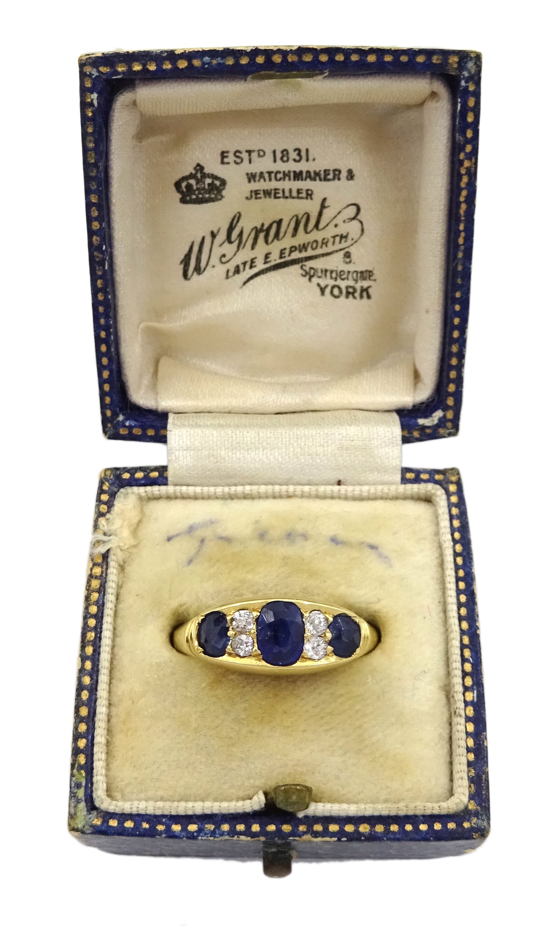 Victorian 18ct gold three stone oval sapphire ring, the central sapphire with two old cut diamonds set either side, Birmingham 1898, total sapphire weight approx 1.00 carat