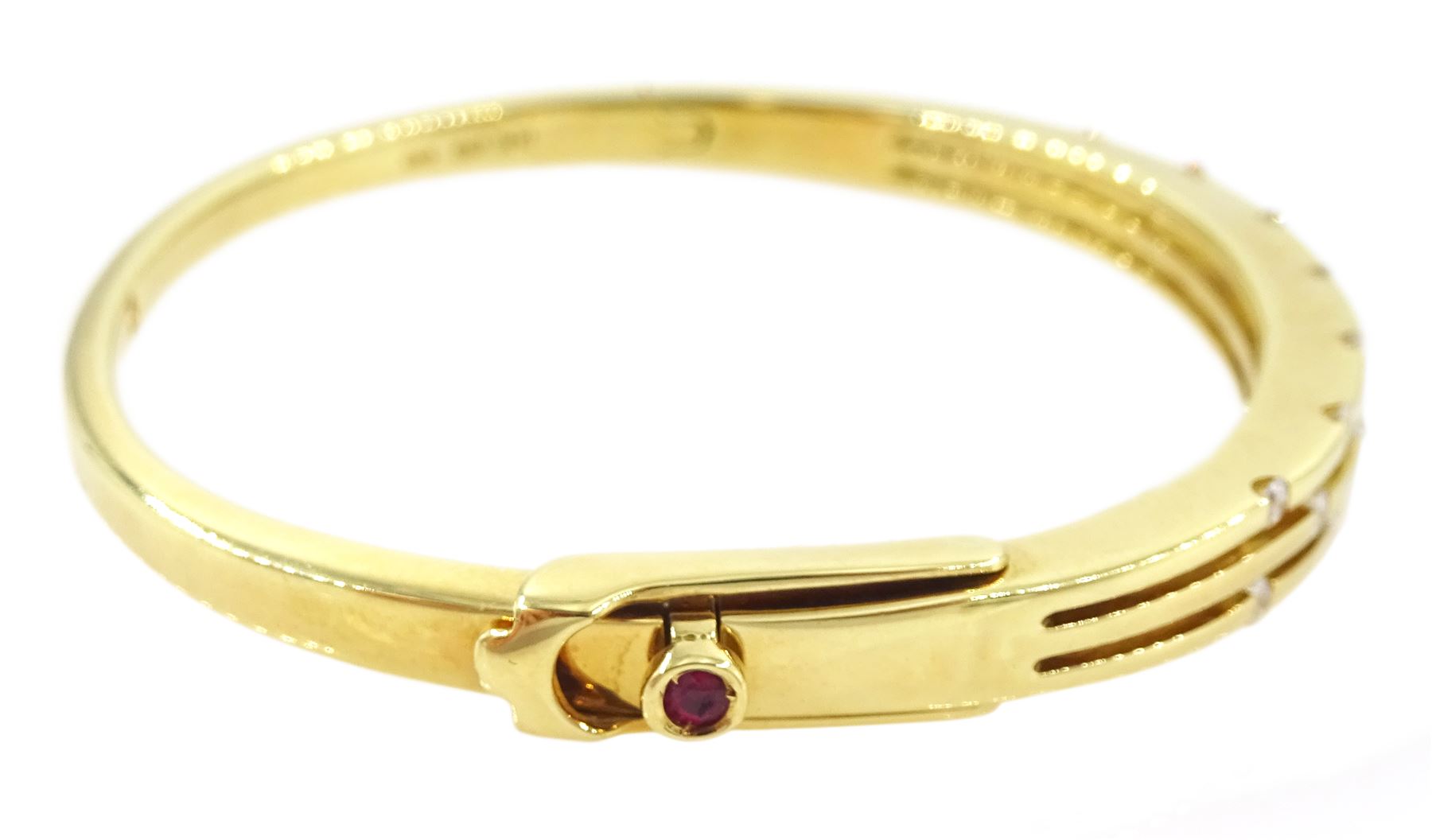 Roberto Coin 'Parisienne' 18ct gold three row round brilliant cut diamond bangle, with a signature round cut ruby to the underside and ruby set clasp, Birmingham 2006, boxed
