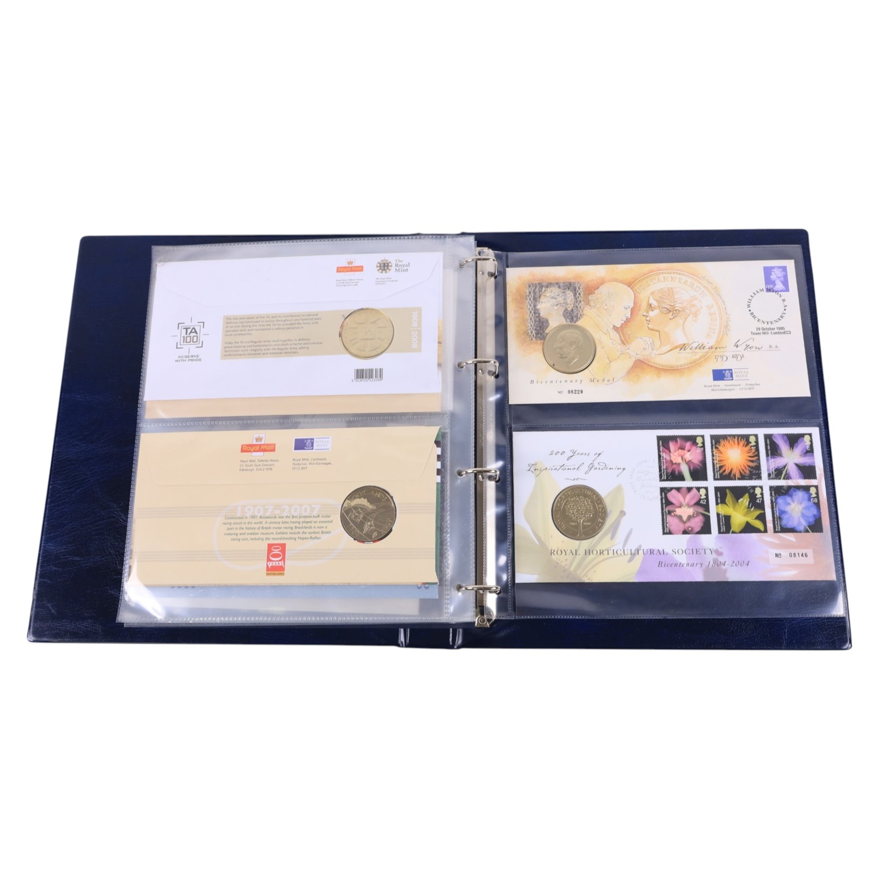 Coin and medallic covers, including 1984 first day issue Scottish one pound coin, 1999 Rugby World Cup with two pound coin, other one pound and two pound coin covers, various Royalty commemorative coin covers etc and various commemorative stamp, housed in five folders