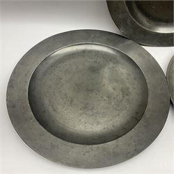 Group of seven 19th century pewter chargers, each of circular form with dished centre, two examples with touch marks verso, each approximately D39cm