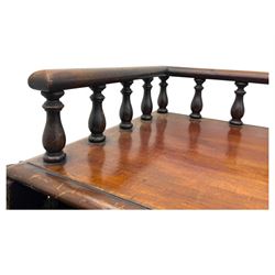 Large Victorian mahogany Registry/Dickens’ desk, spindle gallery top, one side with five small drawers and the other with blind cupboard drawer, revealing pigeon holes with scroll carved locking side bars on either side, above a hinged and leathered writing slope with three drawers and pigeon holes underneath, above a central locking drawer with key, the pedestals each with four drawers and  turned knob handles, separates into four parts for transport