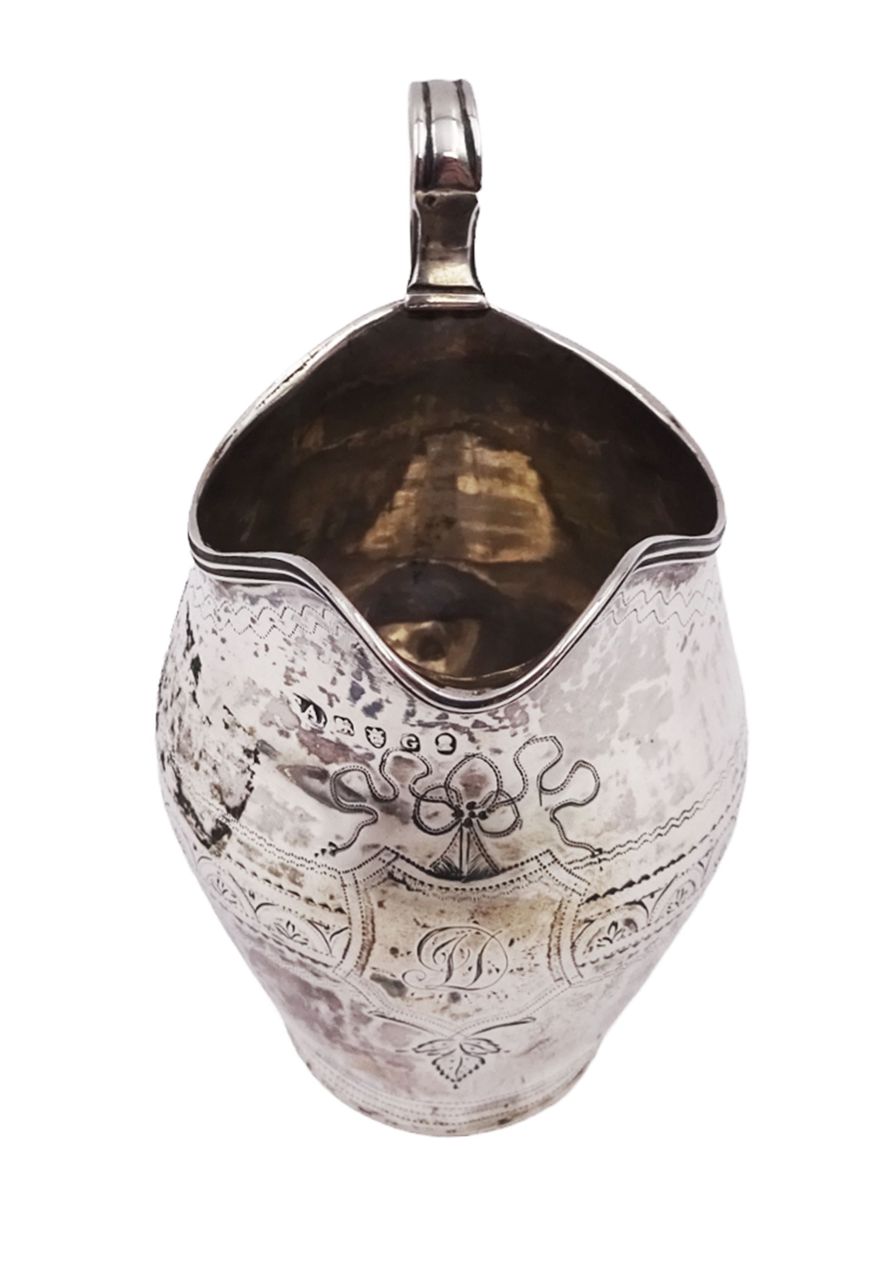 George III silver cream jug, of helmet form, with C scroll handle and a band of engraved strapwork decoration and monogrammed initials to body, hallmarked London 1802, maker's mark SA probably Stephen Adams I, including handle H10.4cm