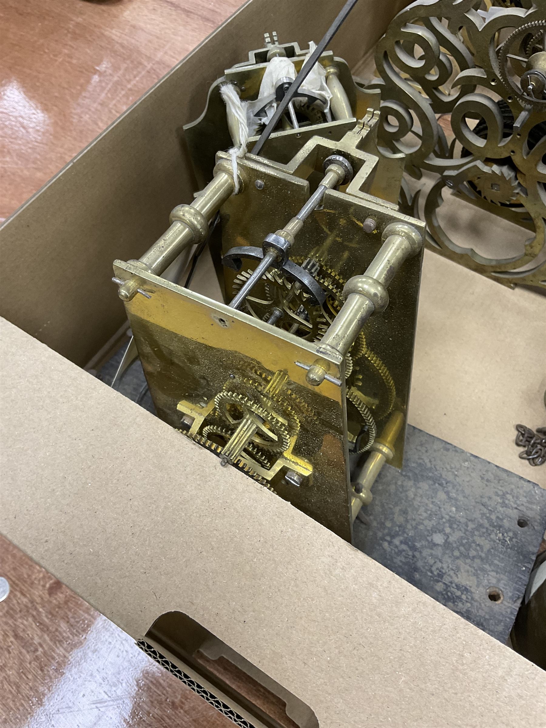 Two skeleton clock movements, tavern clock movement, and further clock movements, all for restoration 