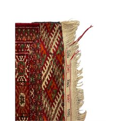 Persian Bokhara rug, red ground and decorated with repeating Gul motifs