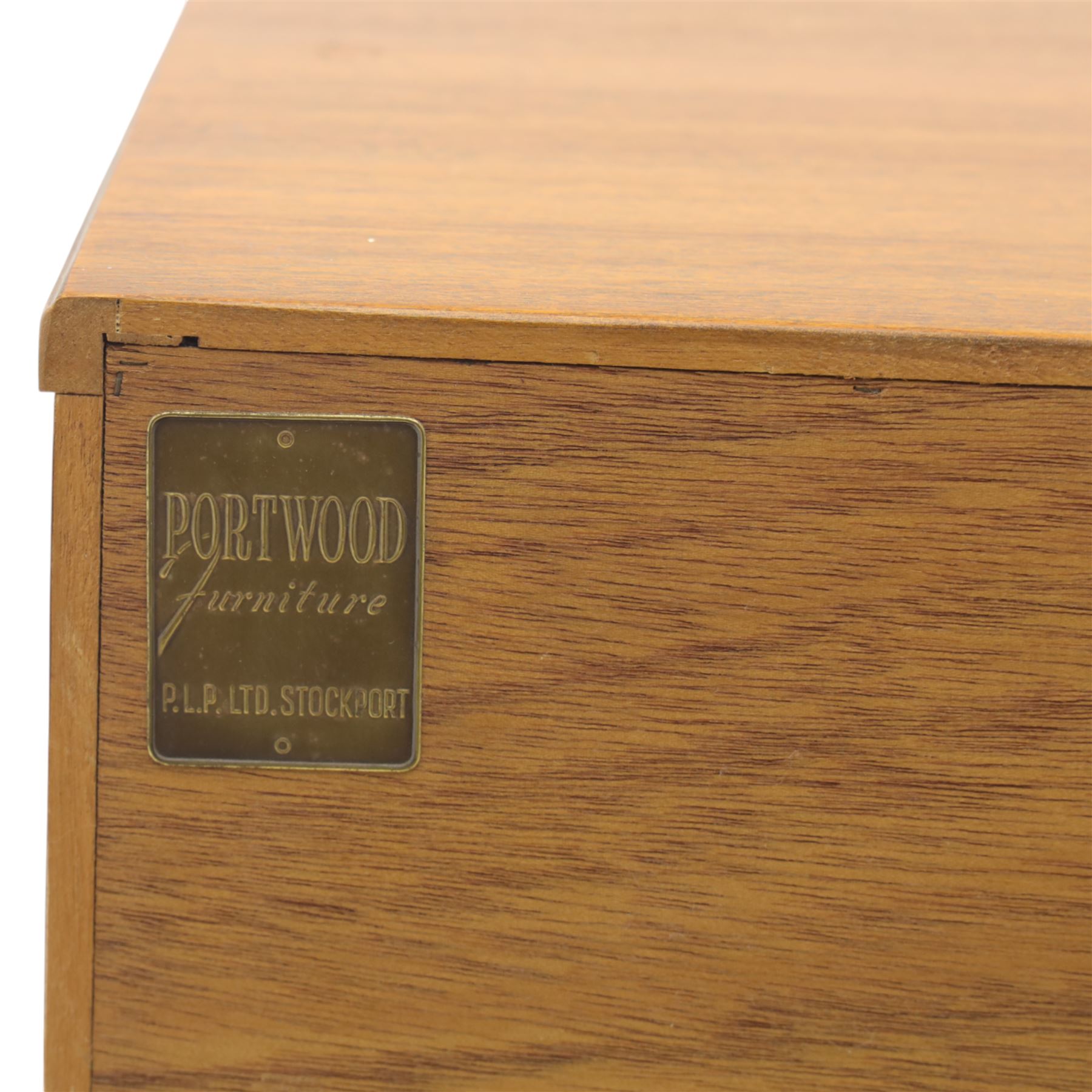 Portwood - Mid 20th century teak sideboard, rectangular top with fall front in the centre flanked by cupboard doors with recessed handles, above four drawers raised on tapered legs