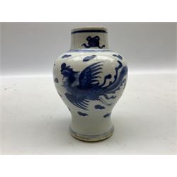 Chinese blue and white vase of baluster form painted with phoenix amongst auspicious clouds, with double ring mark beneath