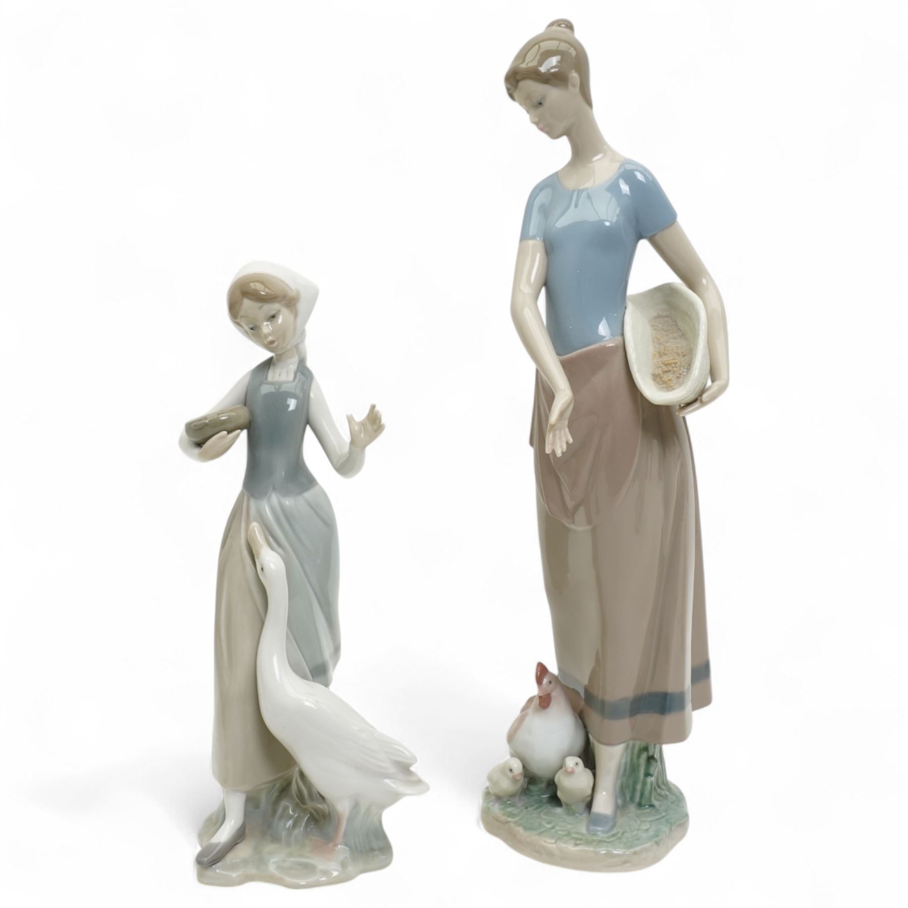 Four Lladro figures, including two golfers and two girls feeding geese and chickens, tallest H33cm (4)